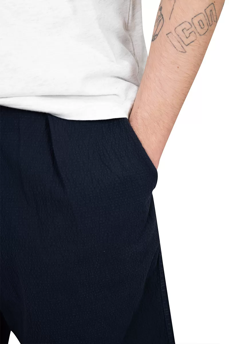 Universal Works. Blue pleated track short